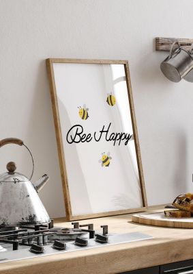 An unframed print of bee happy quote in typography in white and yellow accent colour