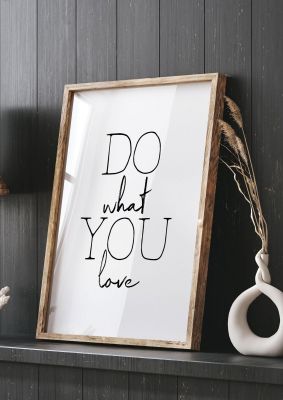 An unframed print of do what you love quote in typography in white and black accent colour