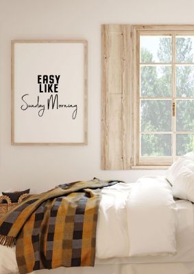 An unframed print of easy like sunday morning quote in typography in white and black accent colour