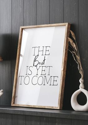 An unframed print of the best is yet to come quote in typography in white and black accent colour