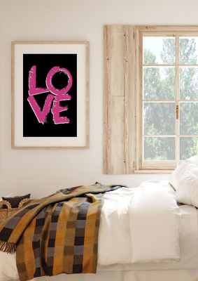 An unframed print of love pink and white in typography in black and pink accent colour