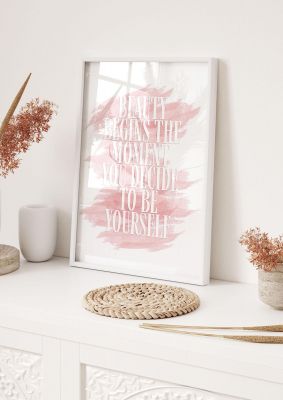 An unframed print of beauty begins the moment quote in typography in pink and white accent colour