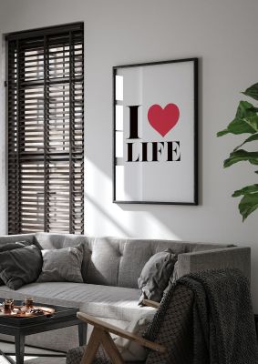 An unframed print of i heart life in typography in white and red accent colour