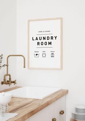 An unframed print of laundry room graphical in typography in white and black accent colour