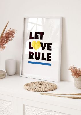 An unframed print of let love rule quote in typography in white and black accent colour