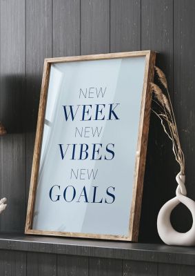 An unframed print of new week quote in typography in blue and black accent colour