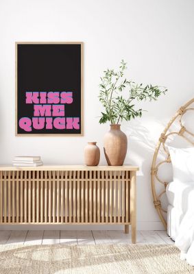 An unframed print of kiss me quick funny slogans in typography in pink and black accent colour