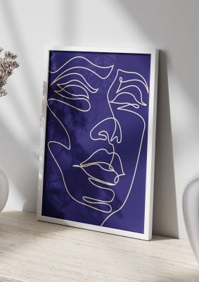 An unframed print of face line drawing blue graphical in blue and white accent colour