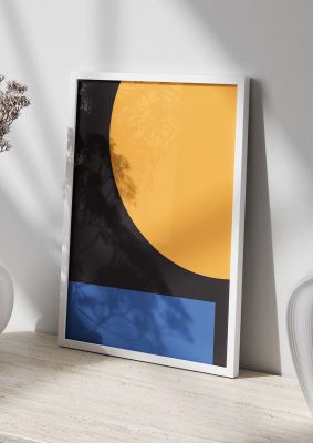 An unframed print of black abstract shapes three graphical in orange and black accent colour