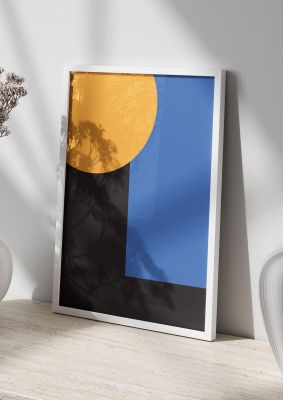 An unframed print of black abstract shapes graphical in blue and yellow accent colour