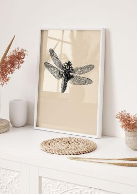 An unframed print of vintage dragonfly graphical illustration in beige and black accent colour