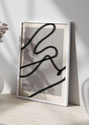 An unframed print of abstract grey black line graphical in grey and black accent colour
