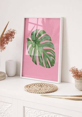 An unframed print of leaf on pink tropical botanical photograph in pink and green accent colour