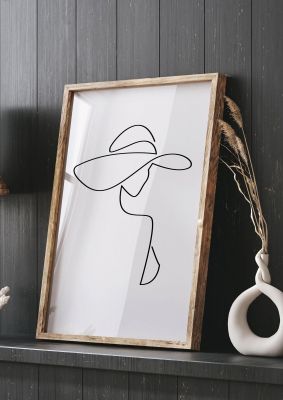 An unframed print of lady in hat line drawing black white graphical in white and black accent colour