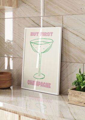 An unframed print of but first champagne funny slogans in typography in beige and pink accent colour