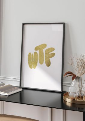 An unframed print of wtf gold in white graphical in typography in white and gold accent colour