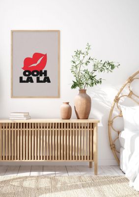 An unframed print of ooh la kiss funny slogans in typography in beige and red accent colour