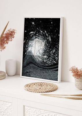 An unframed print of abstract star twirl pattern in black and white
