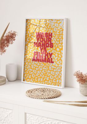 An unframed print of filthy animal home alone leaopard quote in typography in orange and red accent colour