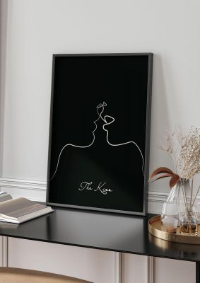 An unframed print of the kiss line drawing black graphical in black and white accent colour
