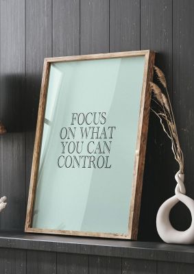 An unframed print of inspirational focus mint green quote in typography in green and black accent colour