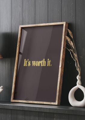 An unframed print of gold inspirational its worth it quote in typography in brown and black accent colour