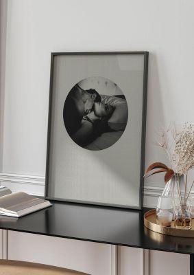 An unframed print of halftone kiss two graphical photograph in grey and black accent colour