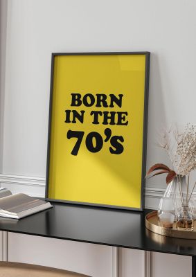 An unframed print of born in the 70's graphical in typography in yellow and black accent colour