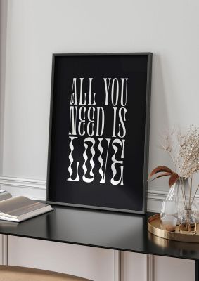 An unframed print of all you need is love lyric black in typography in black and white accent colour