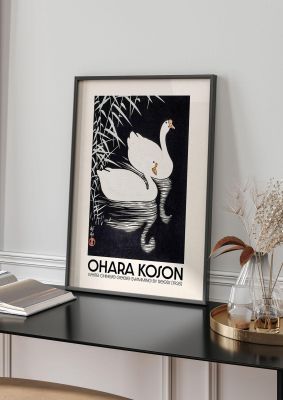 An unframed print of ohara koson white chinese geese swimming by reeds 1928 a famous paintings illustration in black and white and beige accent colour