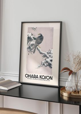 An unframed print of ohara koson goshawk on snow covered pine bough a famous paintings illustration in pink and beige accent colour