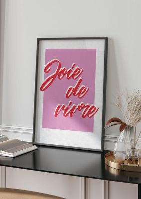 An unframed print of joie de vivre joy of living funny slogans in typography in pink and red accent colour