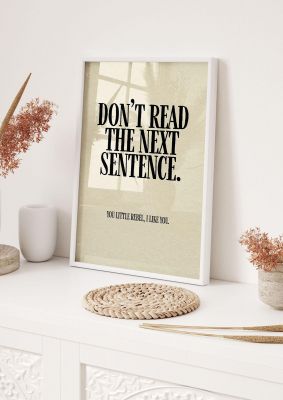 An unframed print of dont read the next sentence quote in typography in beige and black accent colour
