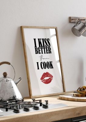 An unframed print of i kiss better than i cook funny slogans in typography in white and red accent colour