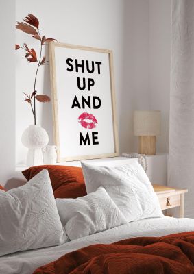 An unframed print of shut up and kiss me funny slogans in typography in white and black accent colour