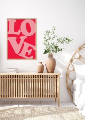 An unframed print of oversized love pink graphical in typography in pink