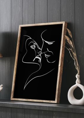 An unframed print of the kiss line drawing black white graphical in black and white accent colour