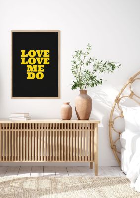 An unframed print of beatles lyric love me do yellow black quote in typography in yellow and black accent colour