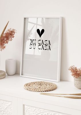 An unframed print of mi casa su casa heart quote in typography in grey and white accent colour